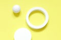 White round geometrical shapes on the brigth yellow background.