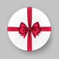 White Round Gift Box with Shiny Red Satin Bow Ribbon Royalty Free Stock Photo