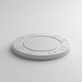 A white, round object resembling a poker chip is centered on a white surface. The Royalty Free Stock Photo