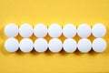 White round pharmaceutical pills on yellow background