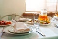 White round plate with serving napkin on table. Royalty Free Stock Photo