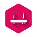 White Router and wi-fi signal icon isolated with long shadow. Wireless ethernet modem router. Computer technology
