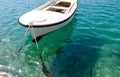 White row boat in crystal clear waters Royalty Free Stock Photo