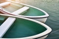 White rowboat moored near shore.