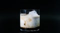 White Russian coktail isolated on black background