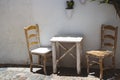 White rustic table and chairs on an outdoor terrace Royalty Free Stock Photo