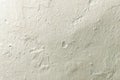 White rustic texture. Retro whitewashed old concrete wall surface. Vintage texture or grunge. Grungy shabby uneven painted gypsum