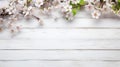 white rustic wooden texture table top view with blossoming spring flowers, with copy space