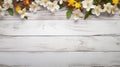 white rustic wooden texture table top view with blossoming spring flowers, with copy space