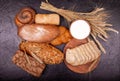 White and rye bread,rolls and cream close-up. Composition with breads. Royalty Free Stock Photo