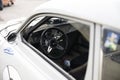 White SAab 96 on a parkinglot with the steeringwheel. Royalty Free Stock Photo