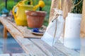 White sachet pouch tied around flower stems in a glass green house to dry for the next gardening season Royalty Free Stock Photo