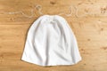 White sack bag on strings on wooden background, mock up