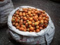 A white sack full of areca nut