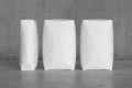 White sacks on the concrete floor. 3d render Royalty Free Stock Photo