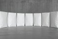 White sacks on the concrete floor. 3d render Royalty Free Stock Photo