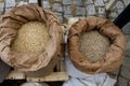 White sacks full with chickpeas, beans, buckwheat, millet, wheat, spelled, lentils, Einkorn wheat grains. Variety of beans, grains