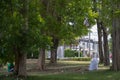 White sacks are used to contain dead leaves that have fallen seasonally in spring as way to clean park and mix leaves to make Royalty Free Stock Photo