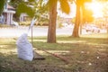 White sacks are used to contain dead leaves that have fallen seasonally in spring as way to clean park and mix leaves to make