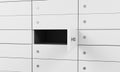 White safe deposit boxes in a bank, one box is open. A concept of storing of important documents or valuables in a safe and secure