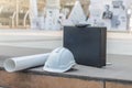 The white safety helmet, the briefcase and the blueprint Royalty Free Stock Photo