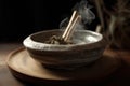 White sage incense burning on porcelain bowl. Royalty Free Stock Photo