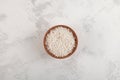 White sago pearls or tapioca pearl in wooden bowl on light textured background, top view Royalty Free Stock Photo