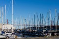 White sail boats in a bay in Lisbon with the 25th April bridge Royalty Free Stock Photo