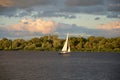 White sail and dramatic apocaliptic sky, Dnepr river