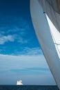 White sail yacht against the blue sky and the sea. Royalty Free Stock Photo