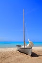 White sailboat on beautiful white beach Royalty Free Stock Photo