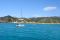 White sailboat heading to Tsambika beach RHODES, GREECE Royalty Free Stock Photo