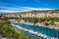 White sailboats moored in rows