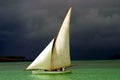 White sailed pirogue on the ocean Royalty Free Stock Photo