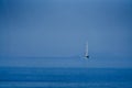 White sailing boat approaching on the sea Royalty Free Stock Photo