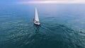 White sailing boat with couple at sea, romantic cruising leisure, freedom Royalty Free Stock Photo