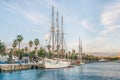 White sailing ship lowered sails moored near the waterfront of Barcelona Royalty Free Stock Photo