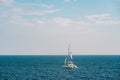 White sailing yacht on the open sea on a bright sunny day Royalty Free Stock Photo