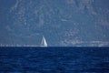 The white sails of yachts on the background of sea and mountains Royalty Free Stock Photo