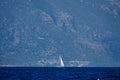The white sails of yachts on the background of sea and mountains Royalty Free Stock Photo
