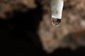 White salt stalactite with a drop of water Royalty Free Stock Photo