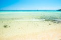 White sand beach and clear sea water under blue sky Royalty Free Stock Photo