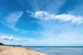 White sand beach with clear wave water over blue sky with white clouds a beautiful scene in nature Royalty Free Stock Photo