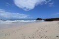 White Sand Beach with Waves Crashing Ashore on Andicuri Beach Royalty Free Stock Photo