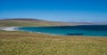 The white sand and blue sea at Sandwick on the island of Unst in Shetland, Scotland, UK