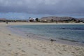 White sand, blue water and stormy clouds on La Concha beach, El Cotillo surfers village, Fuerteventura, Canary islands, Spain Royalty Free Stock Photo