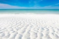 White sand curve or tropical sandy beach with blurry blue ocean and blue sky background image for nature background or summer