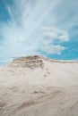 White sand desert and blue sky on background vertical image
