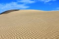 White sand dune under clear blue sky and white cloud Royalty Free Stock Photo