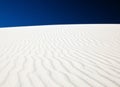 White sand dune with wind patterns Royalty Free Stock Photo